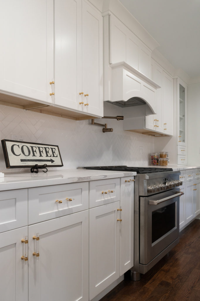Fabuwood white shaker kitchen cabinets with quartz countertops and stainless steel appliances in Wallingford, CT